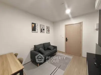 Modern living room with minimalist decor and cozy seating area.