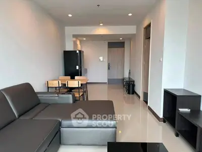 Modern living room with sleek furniture and open layout in a contemporary apartment.