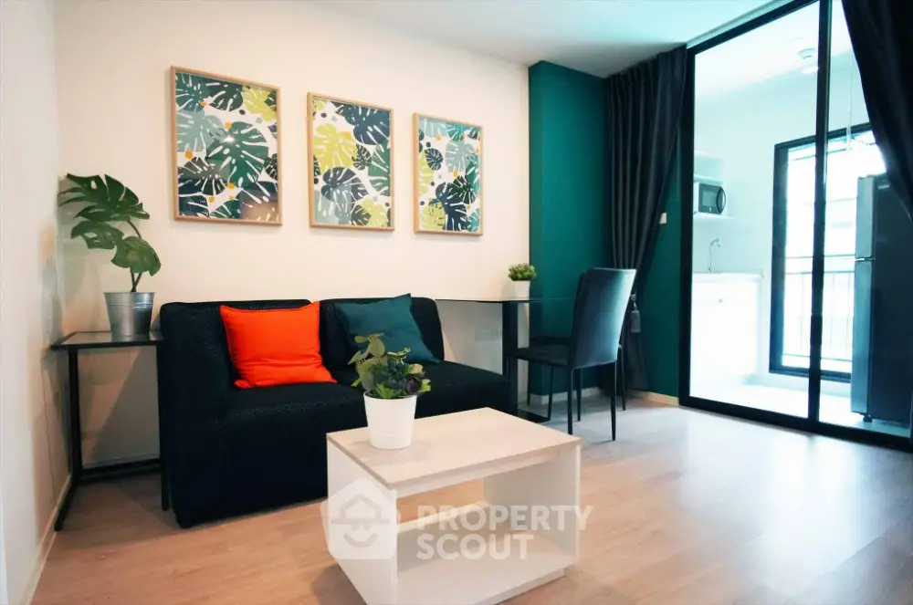 Modern living room with vibrant decor and open layout near kitchen area