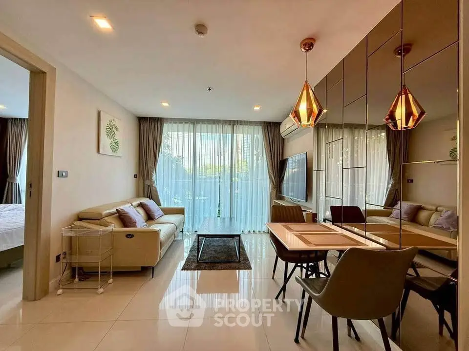 Modern living room with elegant decor and large windows in a stylish apartment.