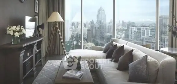 Luxurious living room with panoramic city view, elegant decor, and cozy seating area.