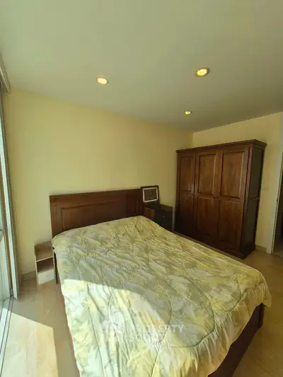 Cozy bedroom with wooden furniture and ample natural light
