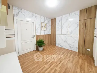 Elegant modern interior with wood flooring and marble accent walls