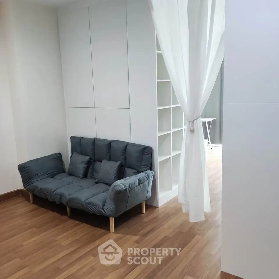 Modern living room with stylish sofa and wooden flooring