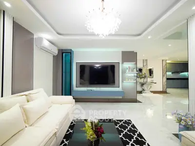 Luxurious modern living room with elegant chandelier and sleek design