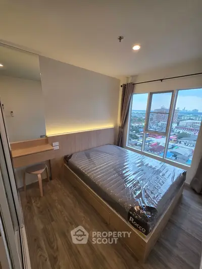 Modern bedroom with city view and stylish wooden furniture