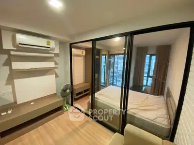 Modern bedroom with glass partition and air conditioning in stylish apartment