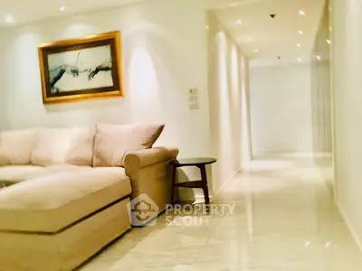 Spacious living room with elegant decor and cozy seating area