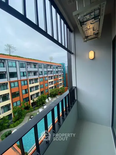 Modern apartment balcony with pool view and stylish lighting