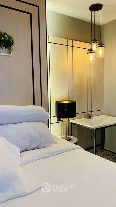 Modern bedroom with elegant lighting and stylish decor