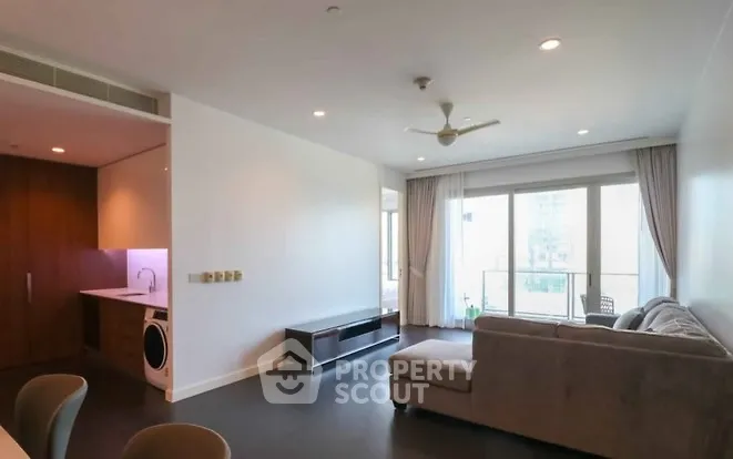 Spacious modern living room with open layout and balcony view