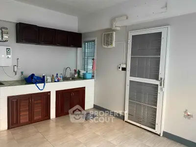 Spacious kitchen with wooden cabinets and modern appliances, ideal for culinary enthusiasts.