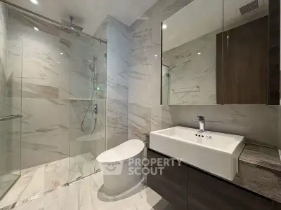 Luxurious modern bathroom with marble tiles and sleek fixtures