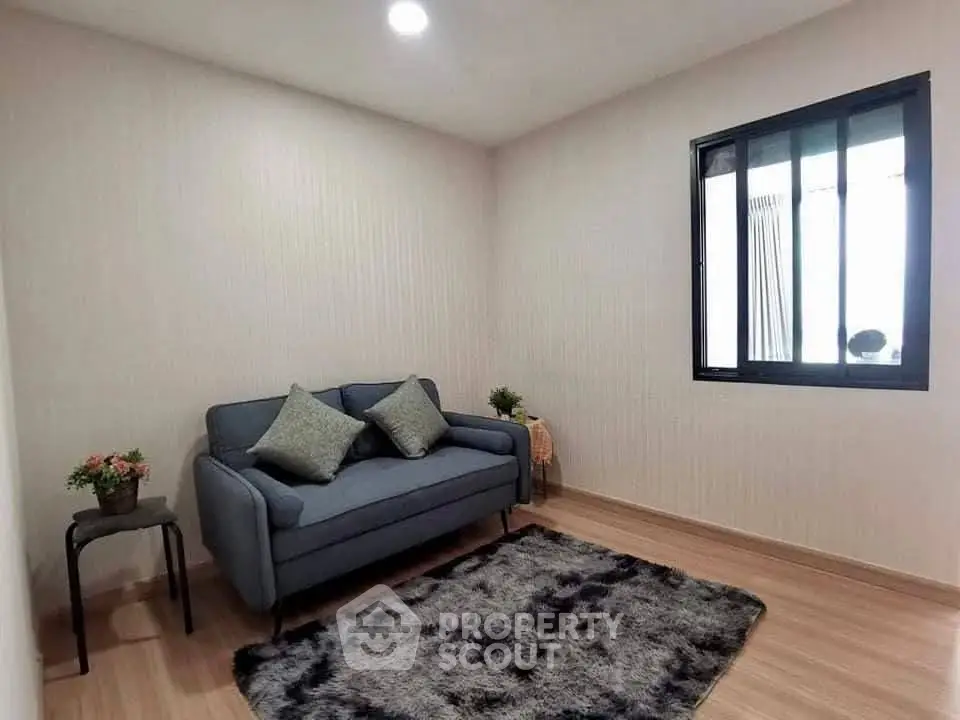 Cozy living room with stylish sofa and plush rug in modern apartment