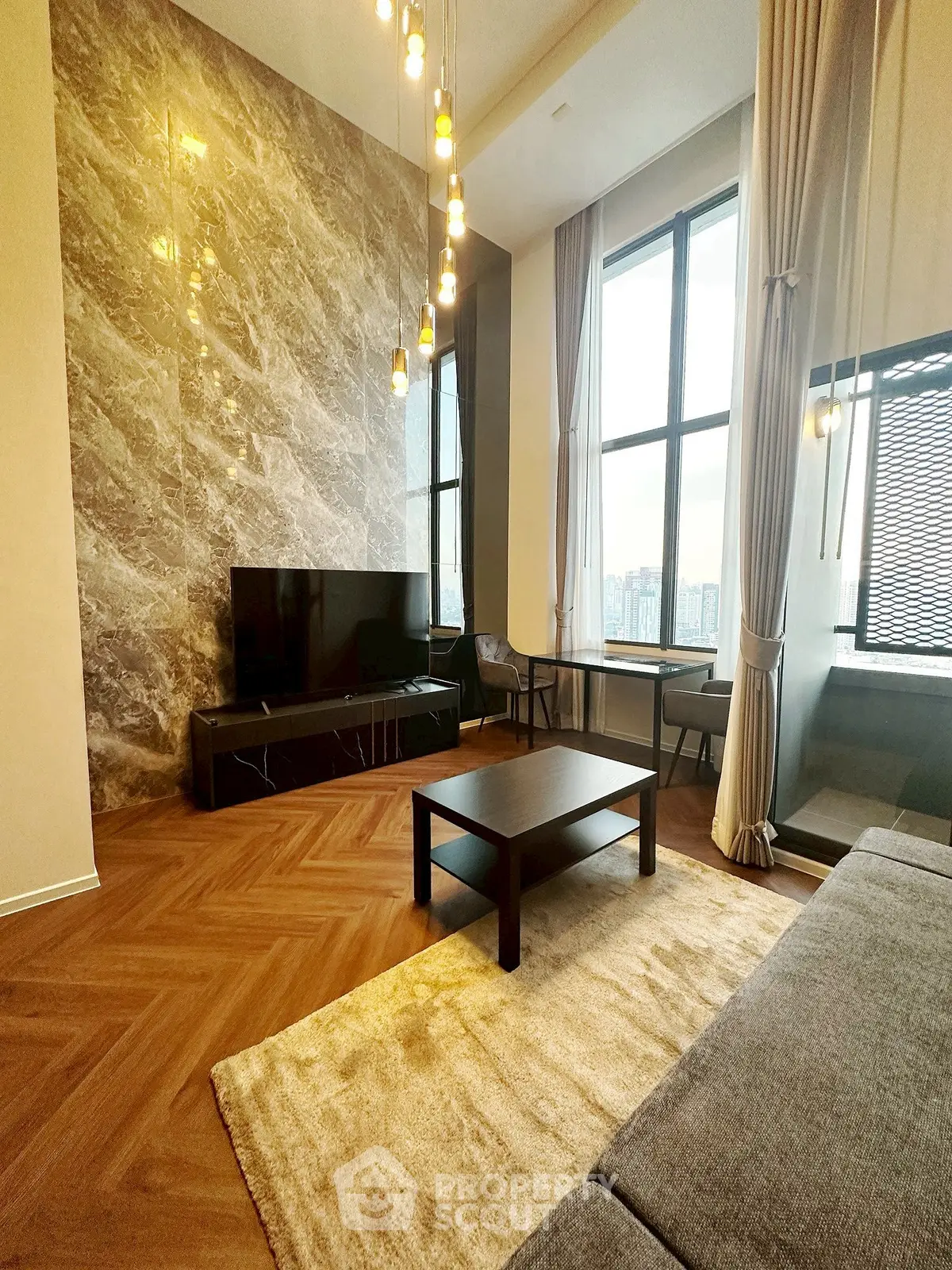 Luxurious high-ceiling living room with modern decor and large windows offering stunning city views.