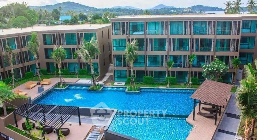 Luxurious apartment complex with stunning pool and lush landscaping