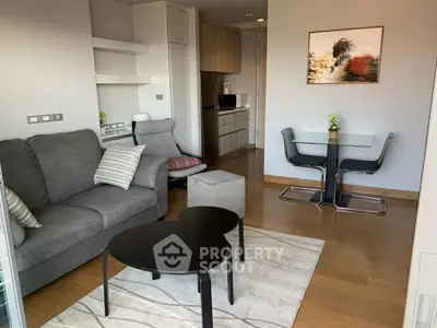 Modern living room with stylish furniture and open kitchen layout, perfect for urban living.