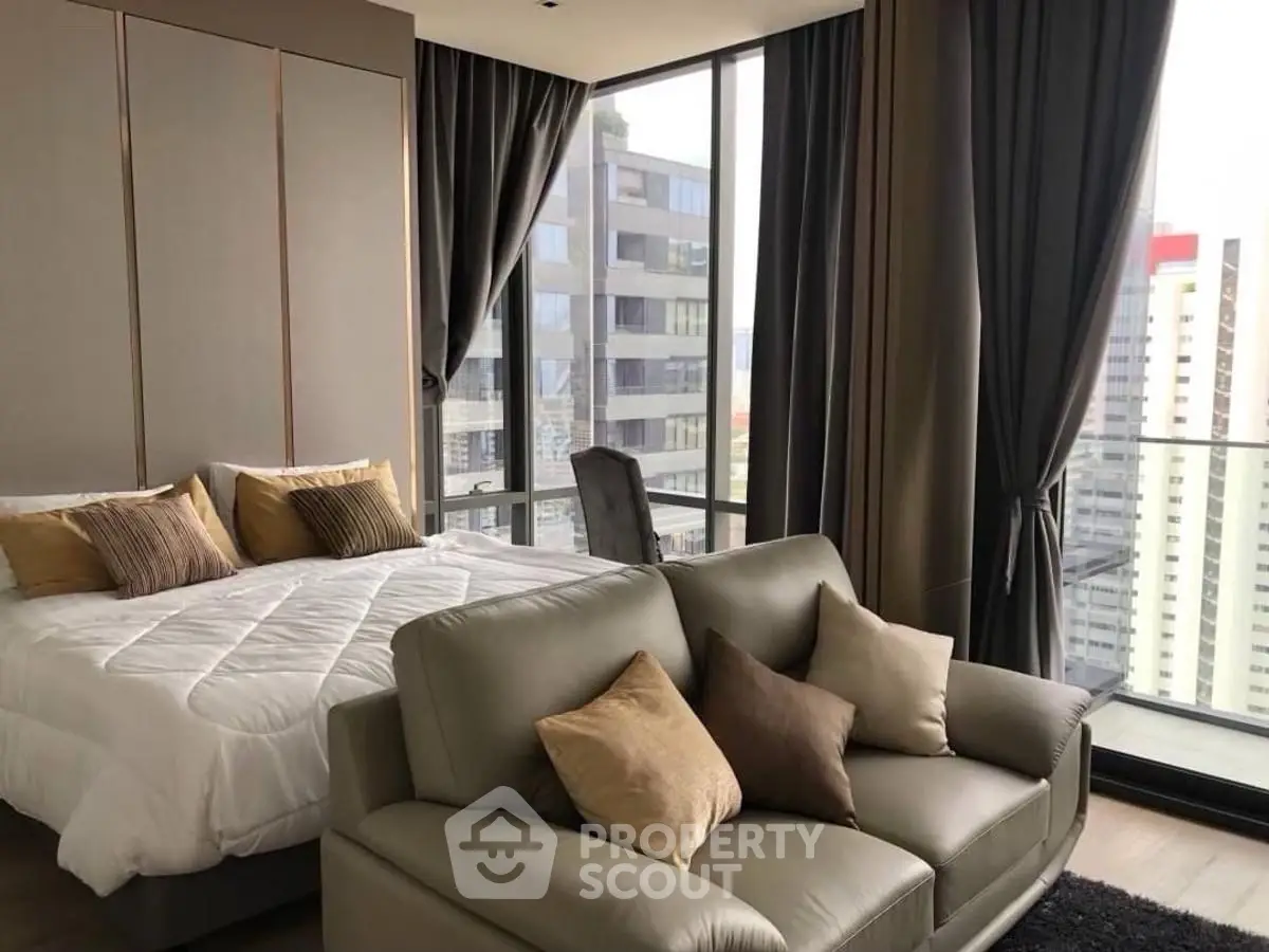 Luxurious bedroom with city view and elegant decor in modern apartment