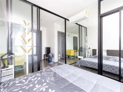 Modern bedroom with mirrored closet doors and stylish decor