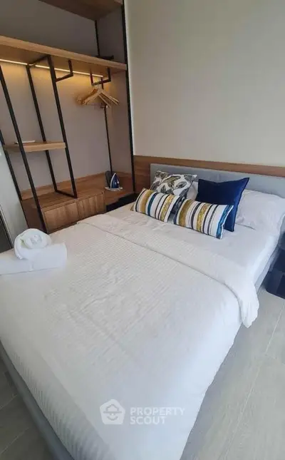 Modern bedroom with stylish decor and ample storage space