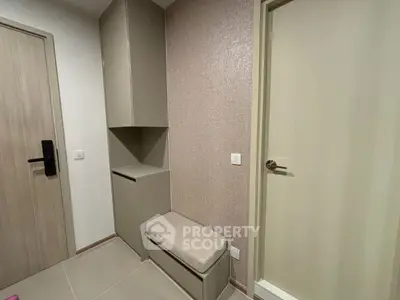 Modern hallway with built-in storage and seating bench