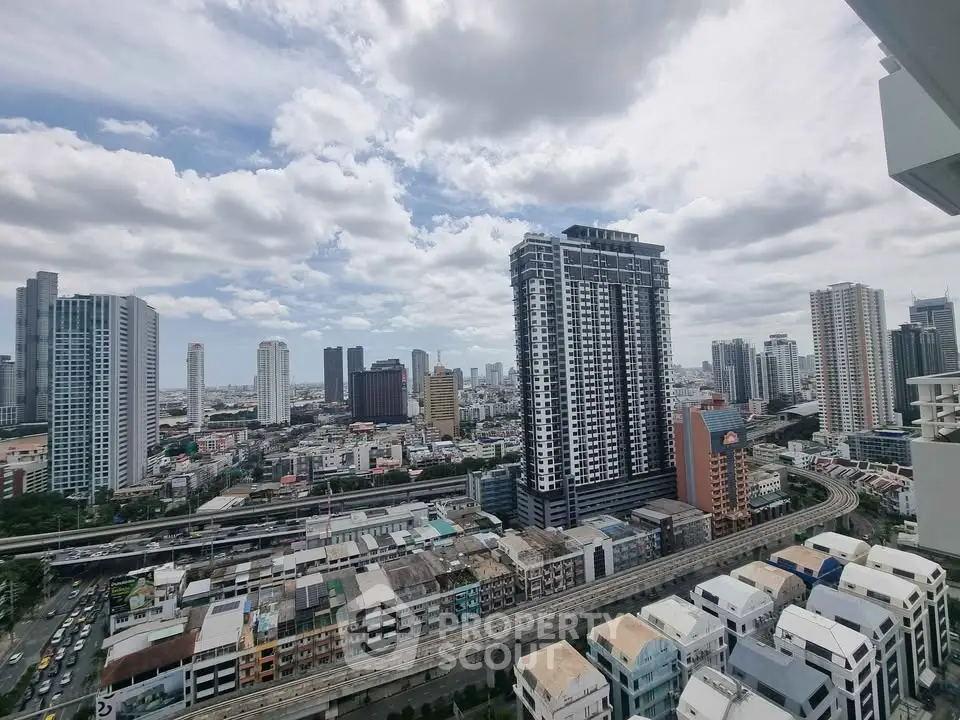 Stunning cityscape view from high-rise balcony showcasing urban skyline and modern architecture.
