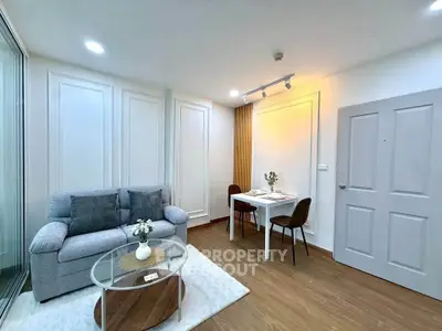 Modern living room with cozy sofa and dining area in stylish apartment