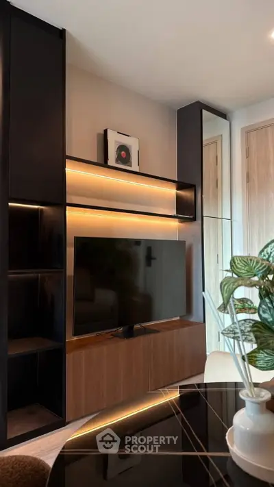 Modern living room with sleek TV unit and ambient lighting