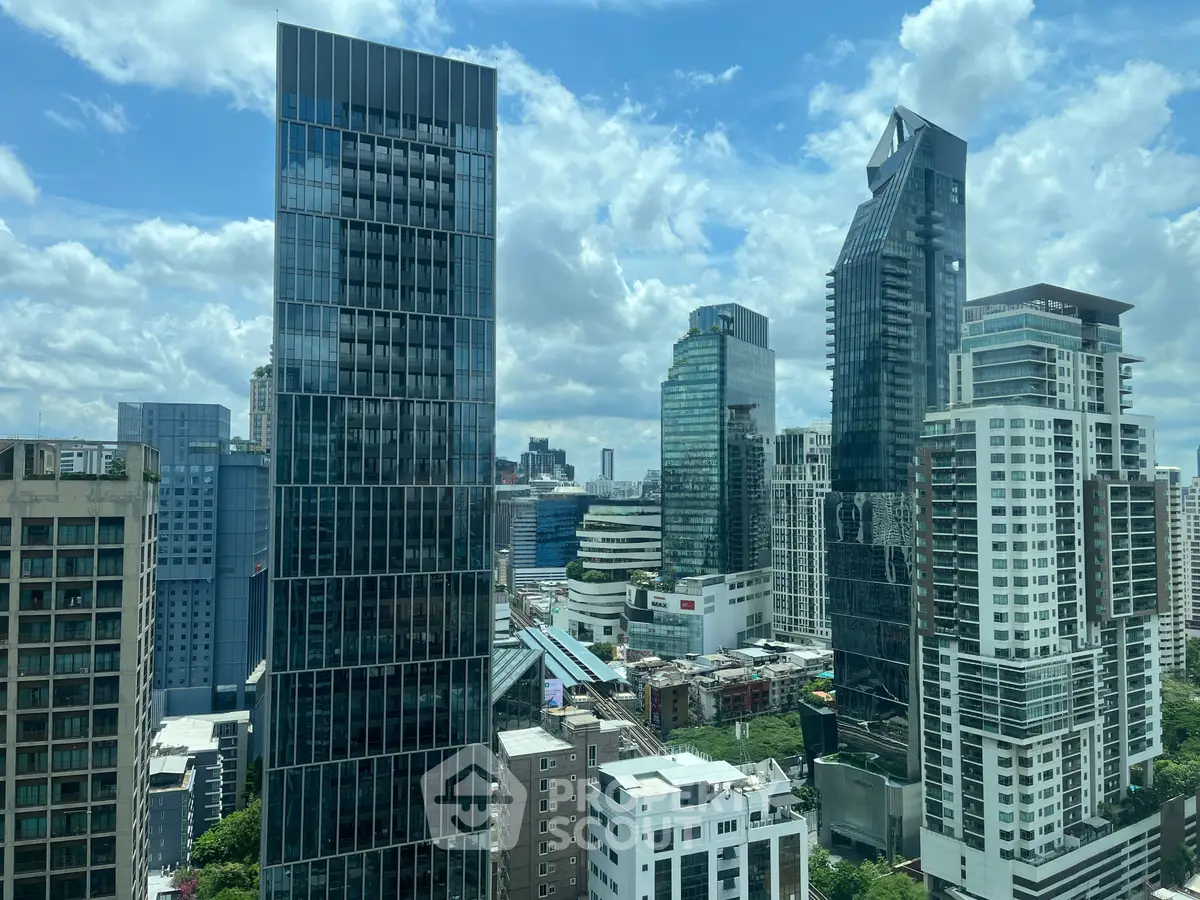 Stunning cityscape view of modern skyscrapers under a vibrant blue sky.