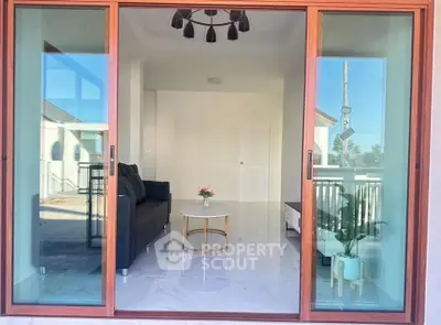 Modern living room with sliding glass doors and elegant decor