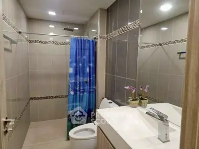 Modern bathroom with sleek design and decorative shower curtain