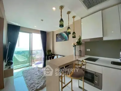Modern open-layout kitchen with stylish decor and balcony view