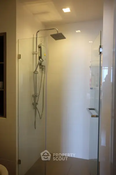 Modern bathroom with sleek shower design and elegant lighting