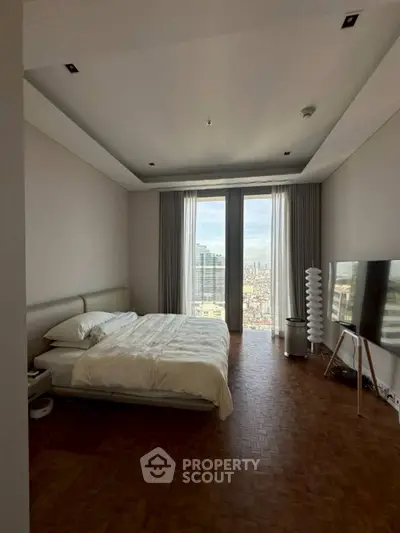 Luxurious bedroom with stunning city view and modern decor