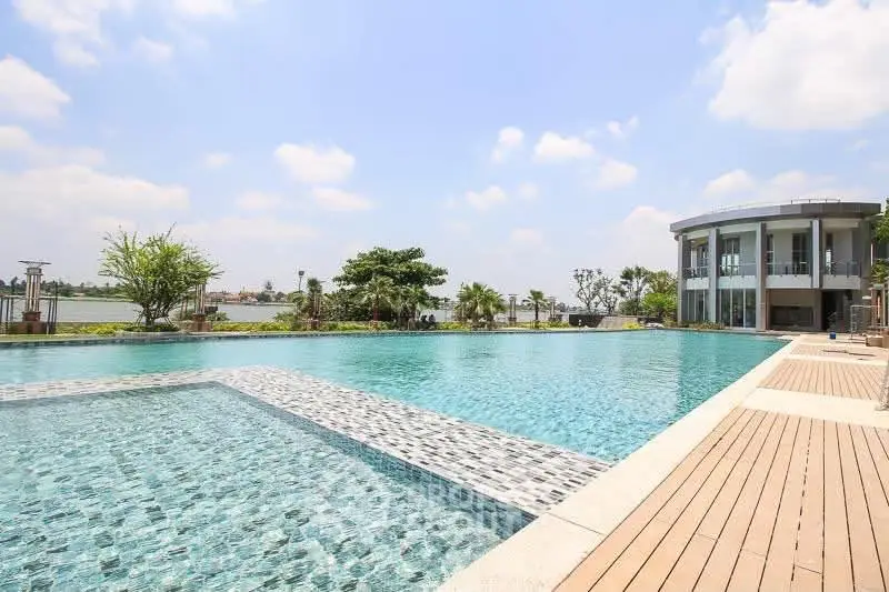 Luxurious poolside view with modern architecture and serene surroundings, perfect for relaxation and leisure.
