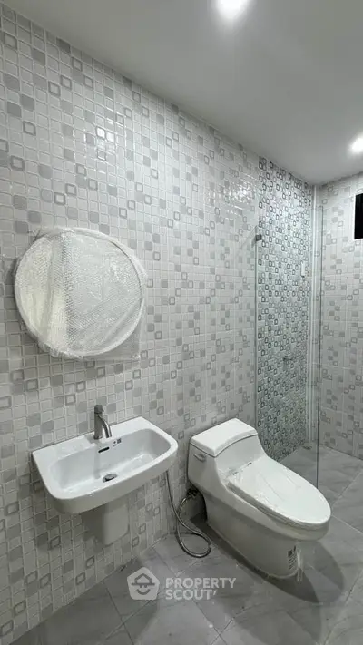 Modern bathroom with sleek fixtures and stylish tile design