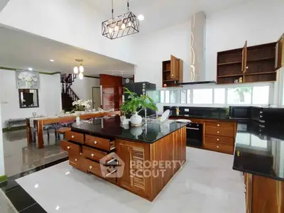 Spacious modern kitchen with open layout and elegant wooden cabinetry