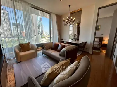 Luxurious living room with city view, elegant chandelier, and modern furniture in high-rise apartment.