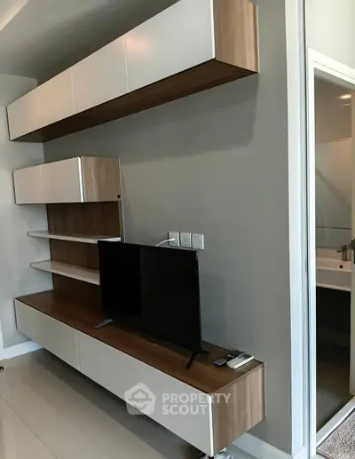 Modern living room with sleek TV unit and minimalist design