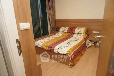 Cozy bedroom with modern wooden furnishings and balcony access