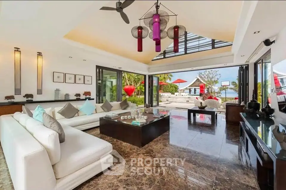 Luxurious open-plan living room with stunning ocean view and modern decor