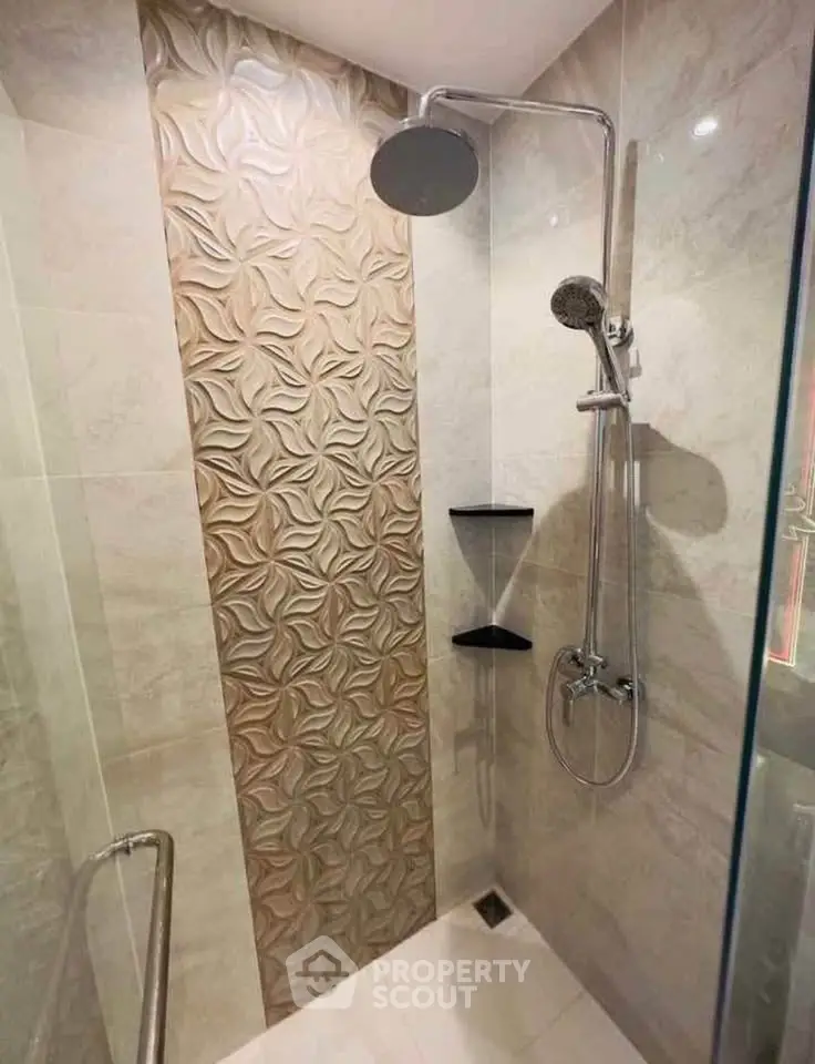 Modern bathroom with elegant shower design and textured wall tiles