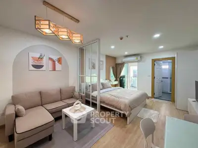 Modern studio apartment with cozy living area and stylish decor