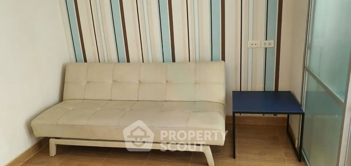 Modern living room with stylish sofa and accent wall design