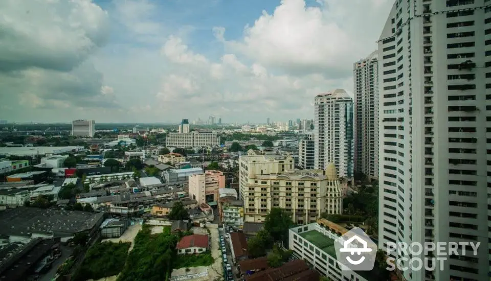 Stunning cityscape view with high-rise buildings and lush greenery, perfect for urban living enthusiasts.