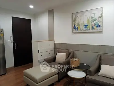 Cozy living room with modern furniture and stylish decor in a contemporary apartment.