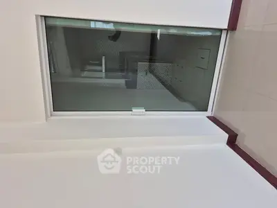 Modern bathroom with large window and sleek design