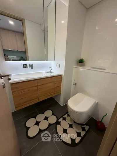 Modern bathroom with sleek fixtures and stylish decor in a contemporary home.