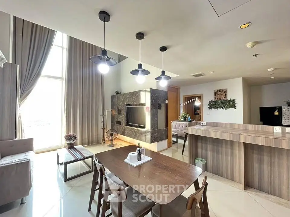 Spacious modern living room with high ceilings and elegant decor