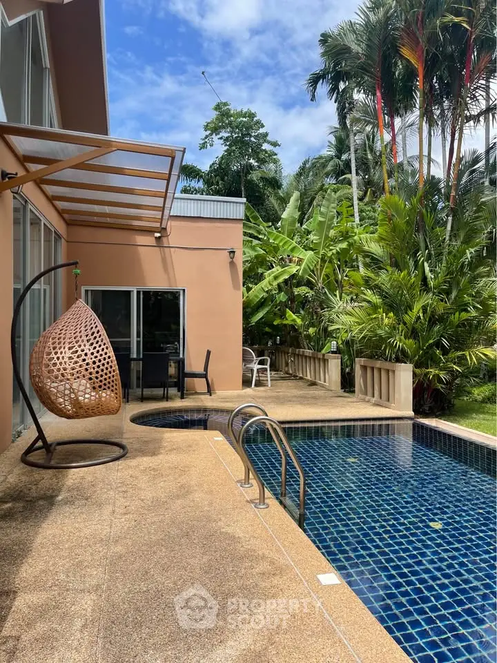 Luxurious villa with private pool and lush garden, perfect for tropical living.